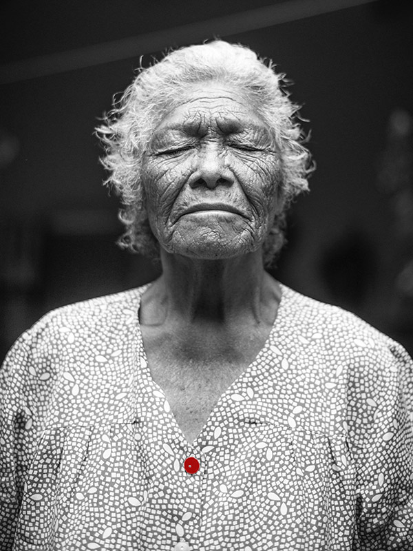 Beautiful older black woman with her eyes closed