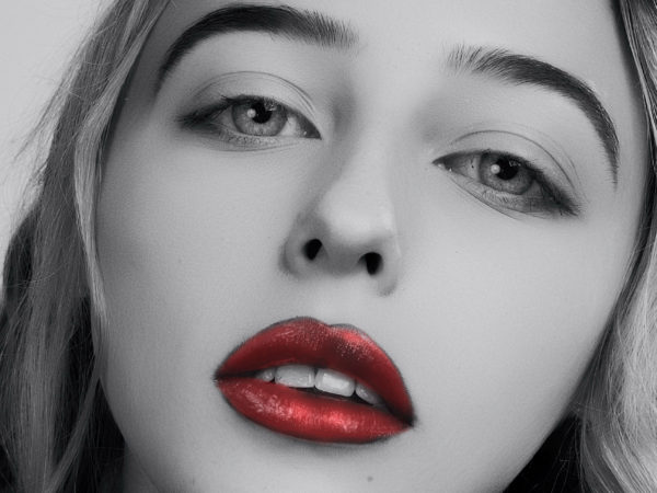 Beautiful young woman with red lipstick