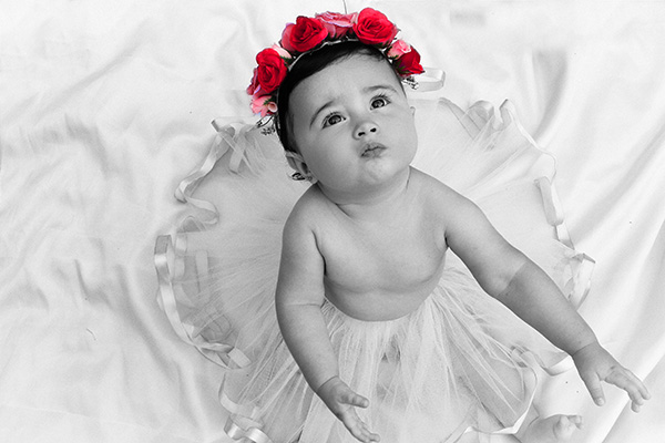 Baby girl with roses on her head